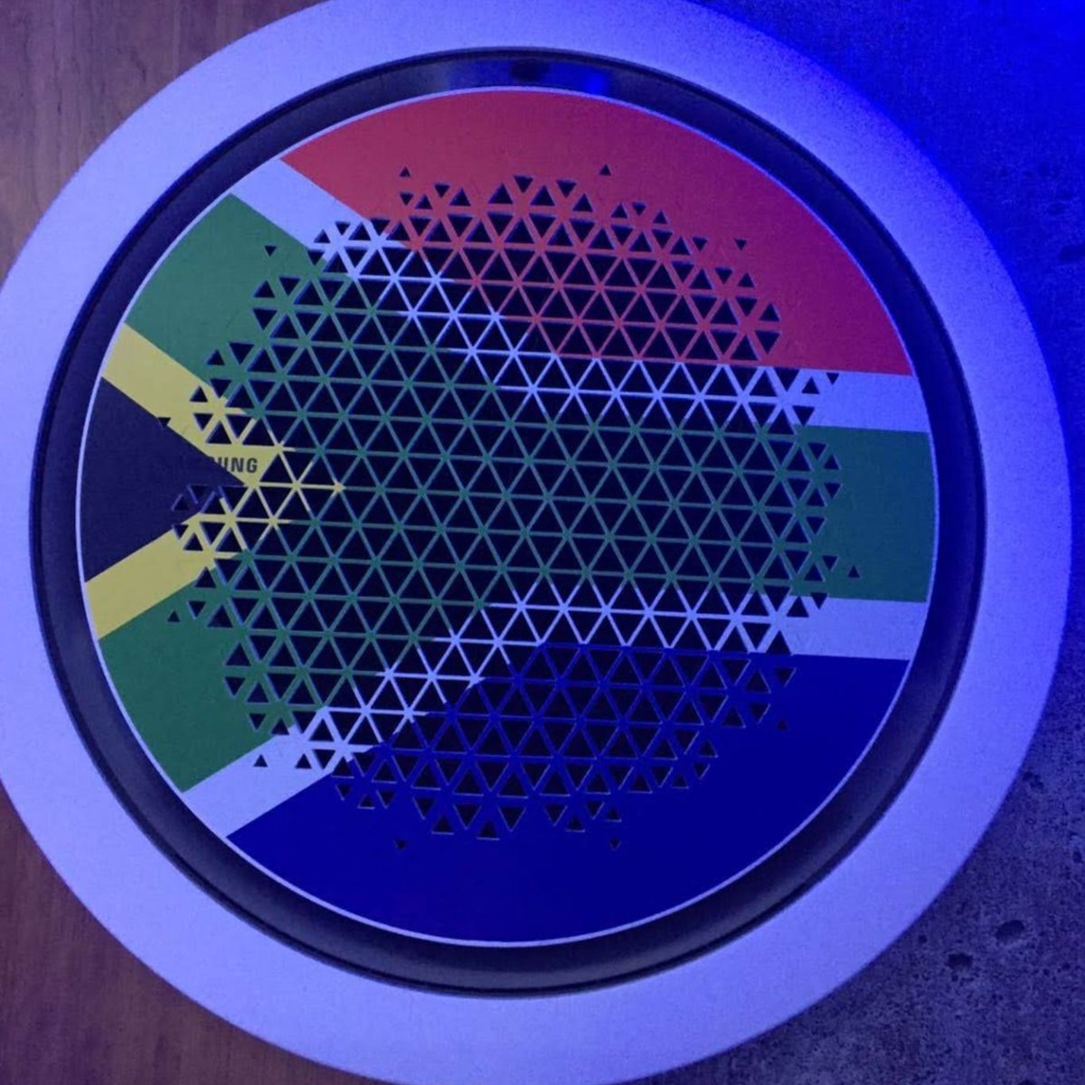 Ceiling cassette air conditioner with a South African flag grille, installed by Leon's Air Conditioning